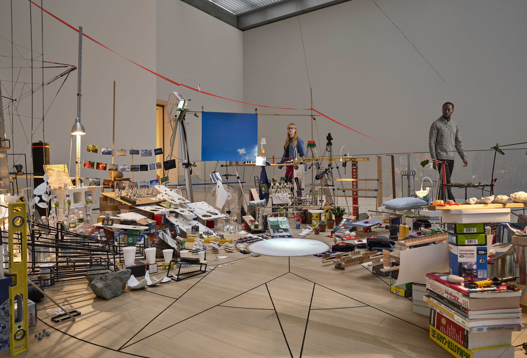 Sarah Sze. Triple Point (Pendulum). 2013. Salt, water, stone, string, projector, video, pendulum, and other materials. Gift of the International Council of The Museum of Modern Art, Agnes Gund, Ronald S. and Jo Carole Lauder, and Sharon Percy Rockefeller, in honor of the 60th Anniversary of the International Council. © 2019 Sarah Sze. Installation view of Surrounds: 11 Installations, The Museum of Modern Art, New York, October 21, 2019–January 4, 2020. Photo: Noah Kalina